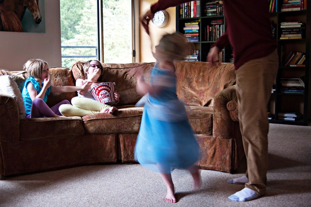 little girl dancing with dad