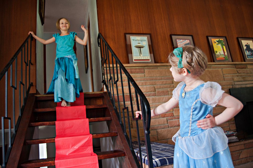 girl walking down red carpet stairs