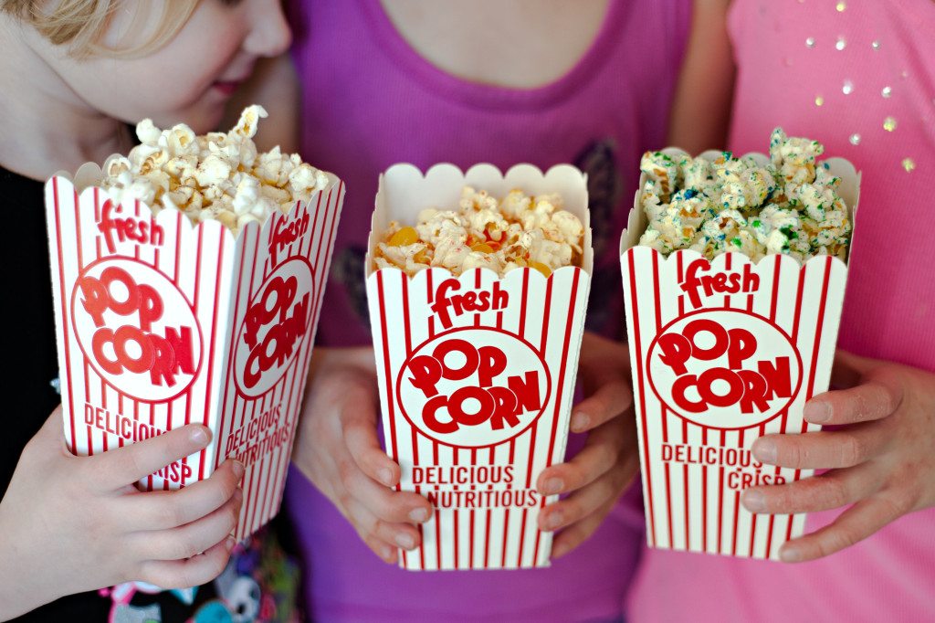 girls with popcorn buckets