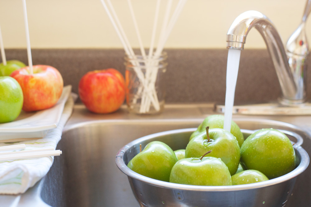 Washing apples in the sink