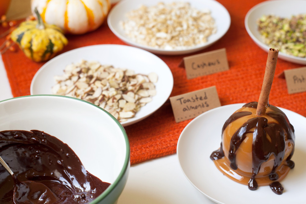 Dipped candy apple, chocolate sauce and other toppings