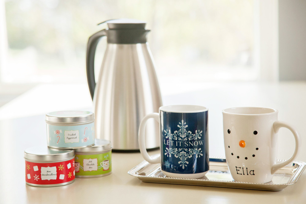 Personalized mugs and a carafe with chocolate mix
