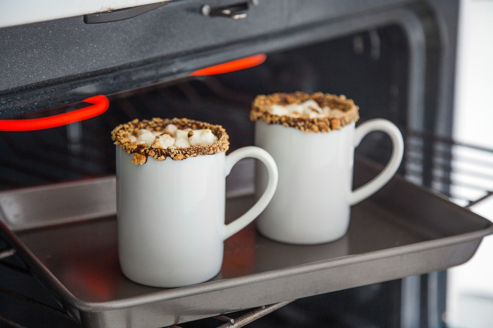 Two mugs in an oven