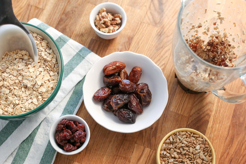 fruit and oats in bowls and a pitcher