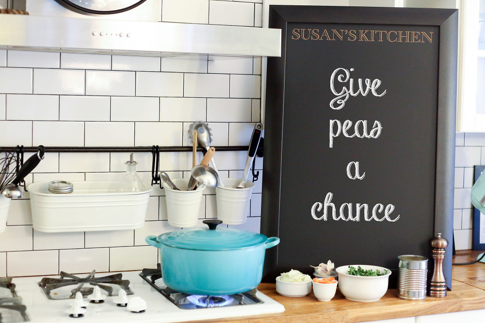 clakboard next to pot on stove