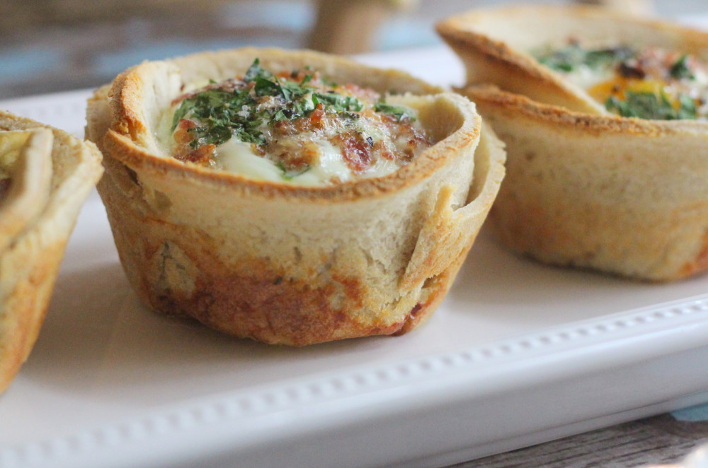 egg toast cups with parsley and bacon on platter
