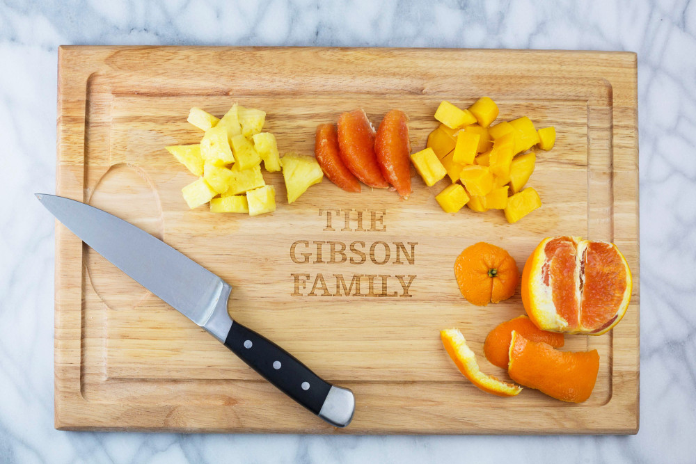 chopped fruiton cutting board with kitchen knife