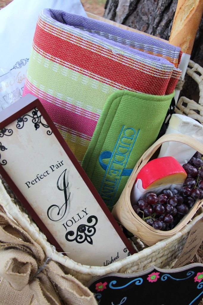 basket full of picnic supplies and fruit