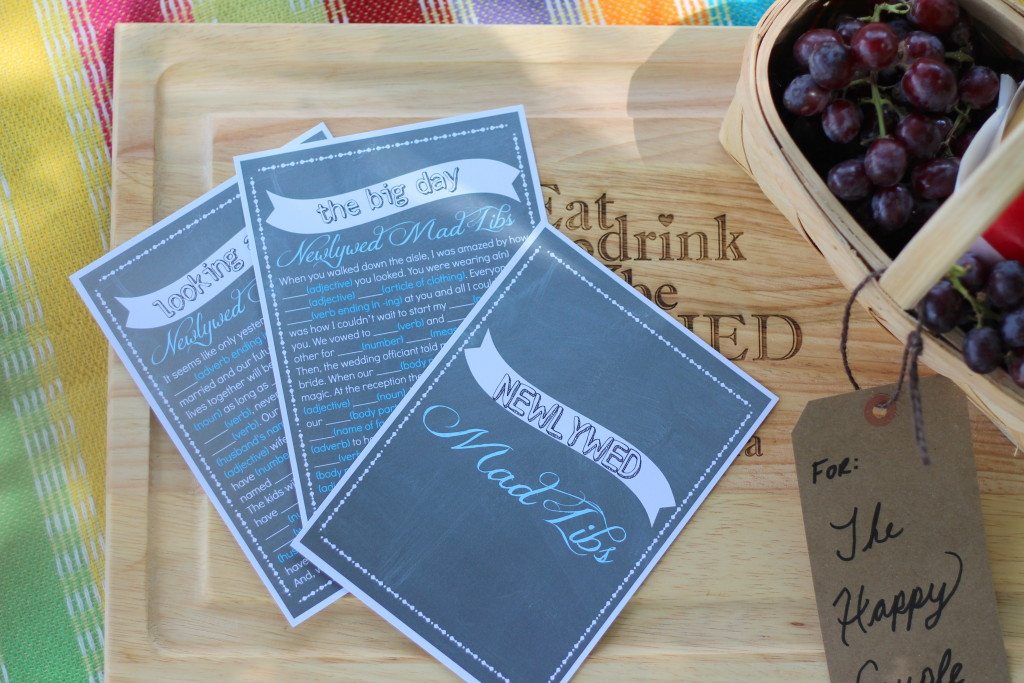 newlywed mad libs and grapes on a cutting board