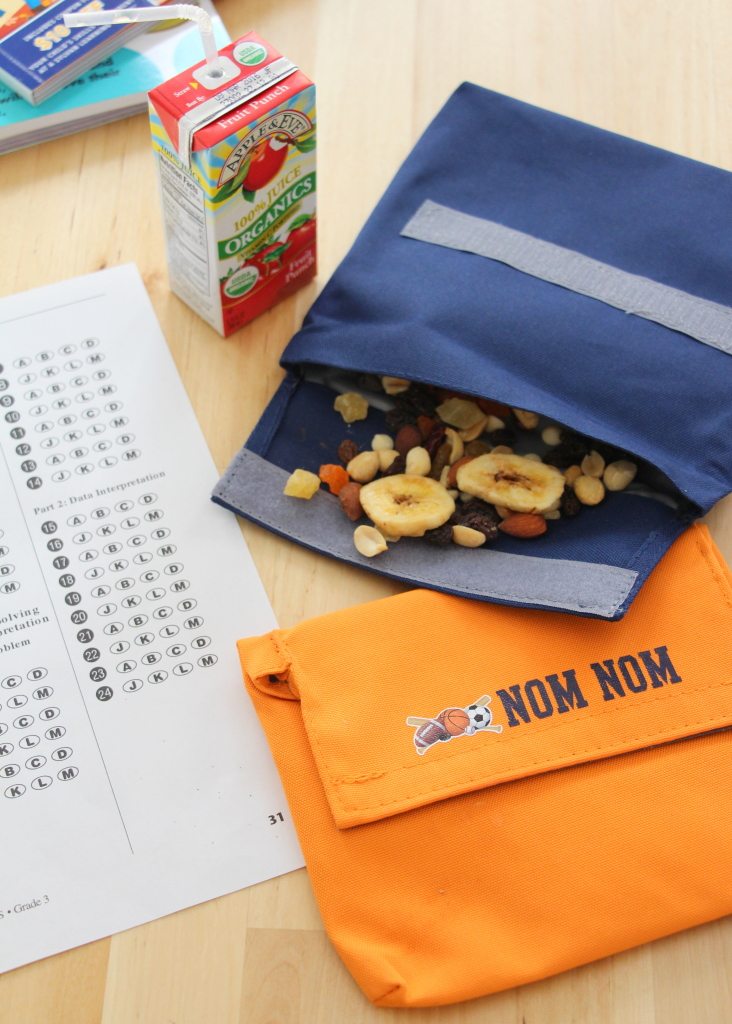 nut fruit mix in pouch with test booklet and juice box on table