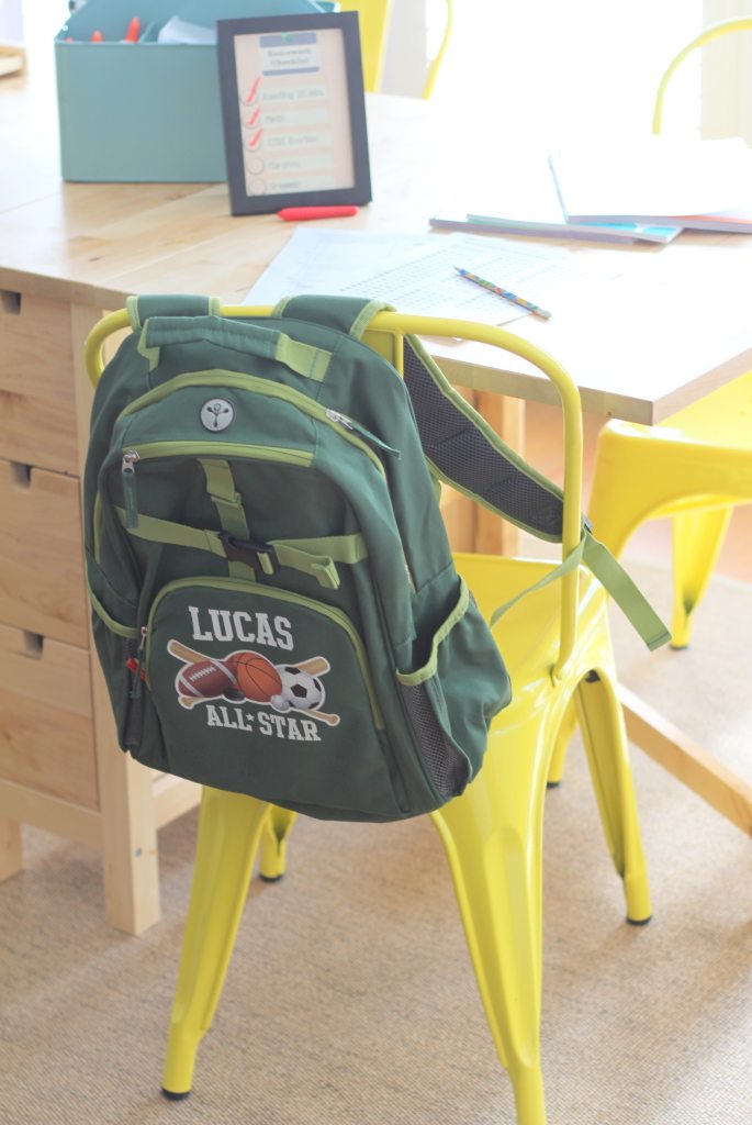 personalized backpack book bag on a yellow chair