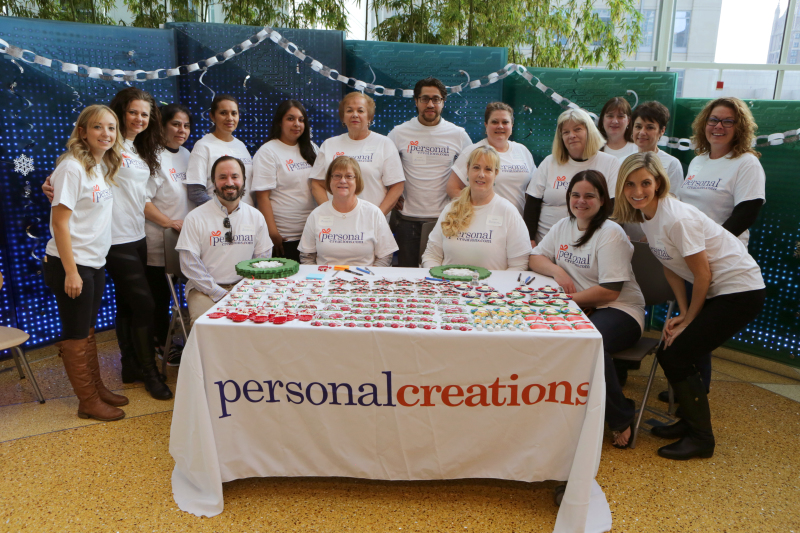 A group of Personal Creations employees spent the day at Ann & Robert H. Lurie Children’s Hospital of Chicago painting and handing out ornaments to kids and their families. Photo by Jean Marc Giboux/AP Images for Personal Creations.