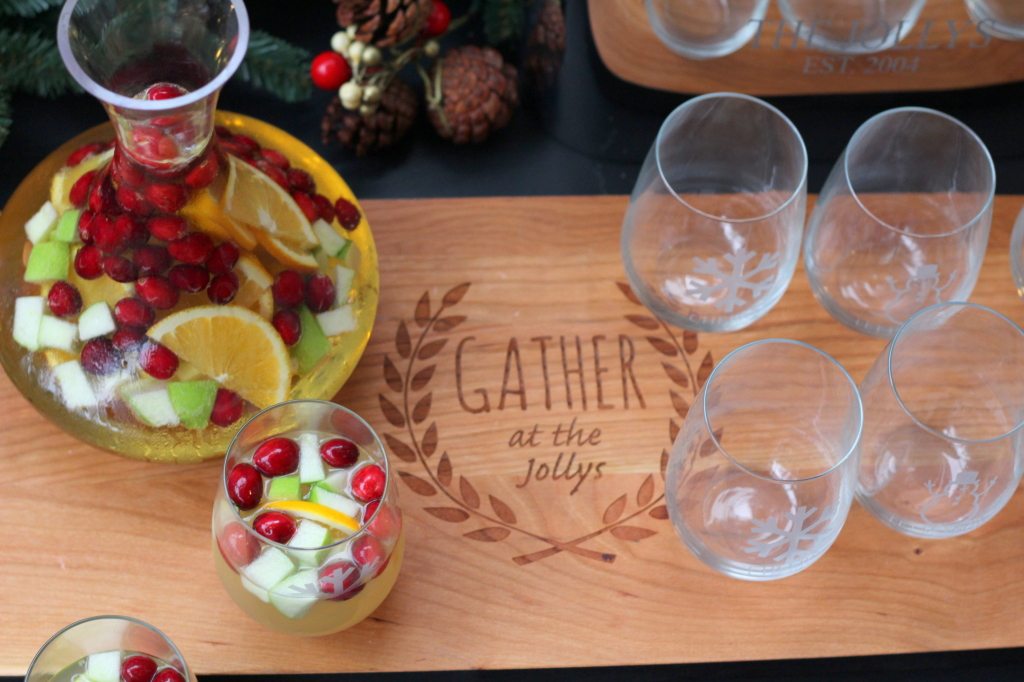 holiday sangria with apples and oranges with glasses on cutting board