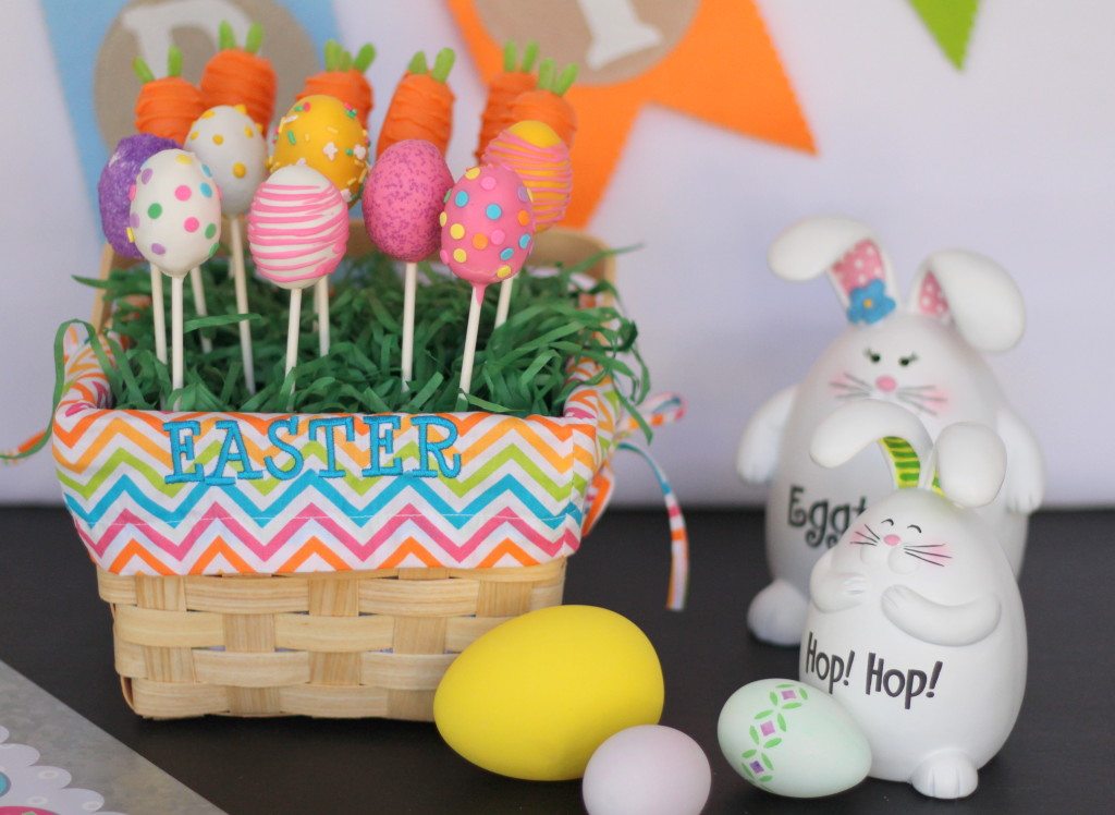 Easter egg and carrot cake pops in a basket with easter decorations