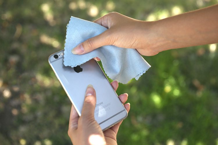 wiping an iPhone lens