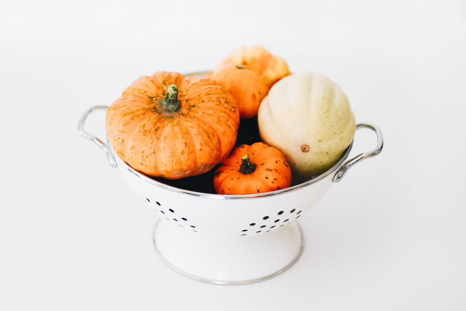pumpkins in a colander 
