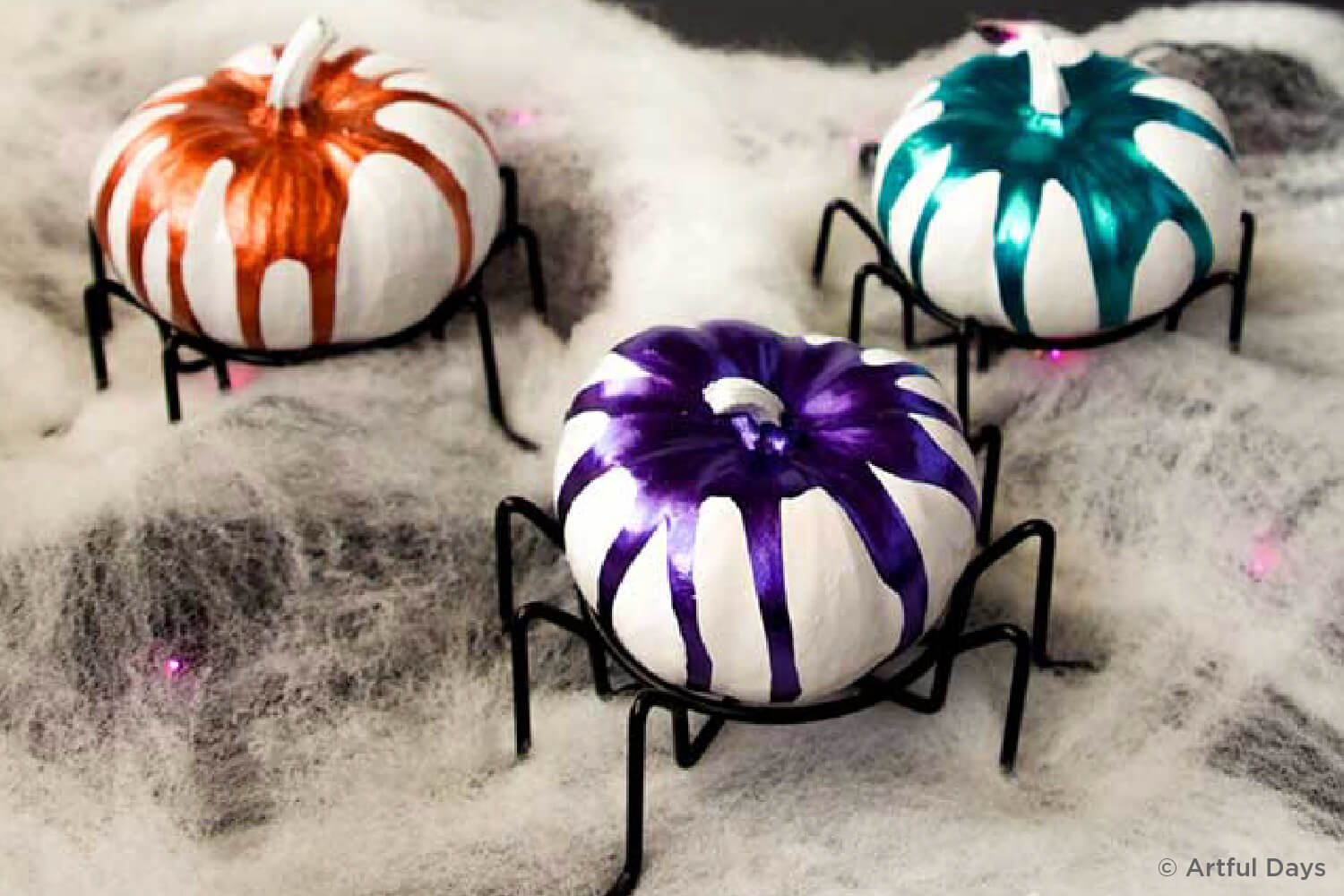 pumpkins decorated to look like spiders
