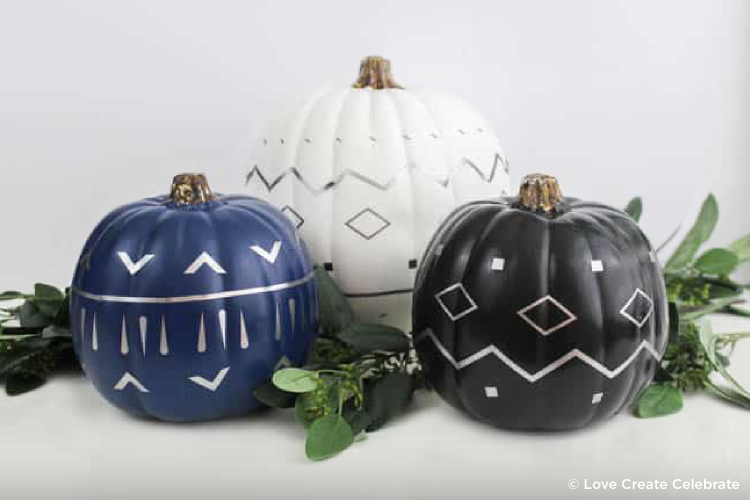 pumpkins painted with geometric designs