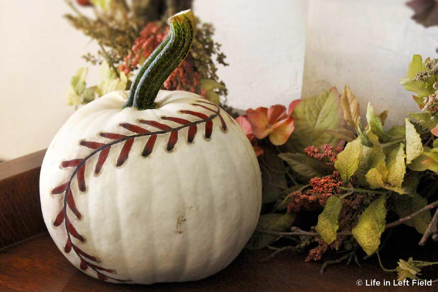 pumpkin painted like a baseball