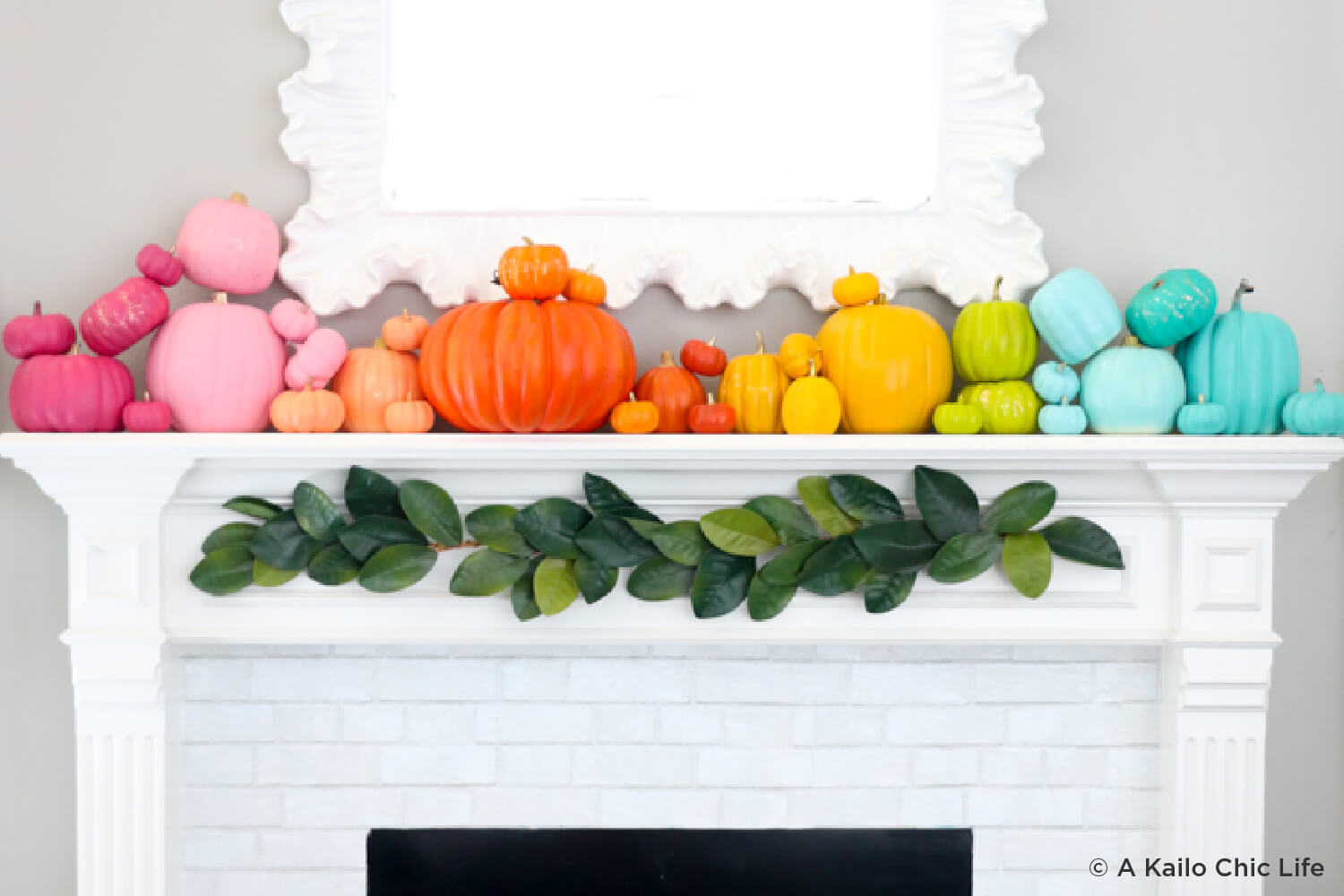 rainbow colored pumpkins on mantle