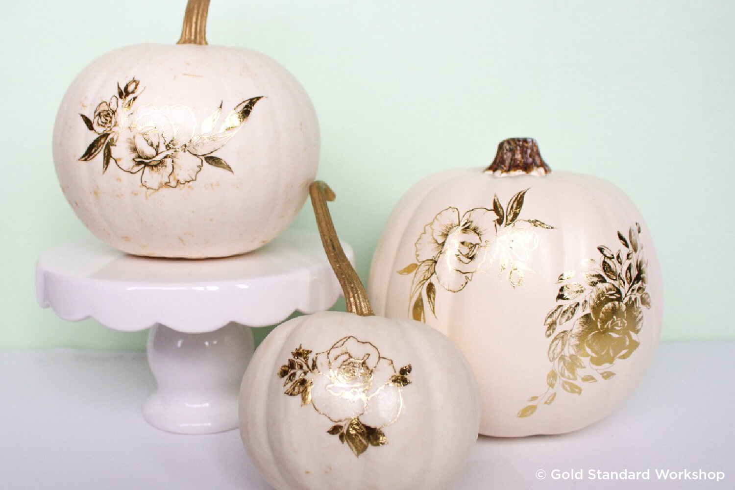 white pumpkins with gold foil tattoos