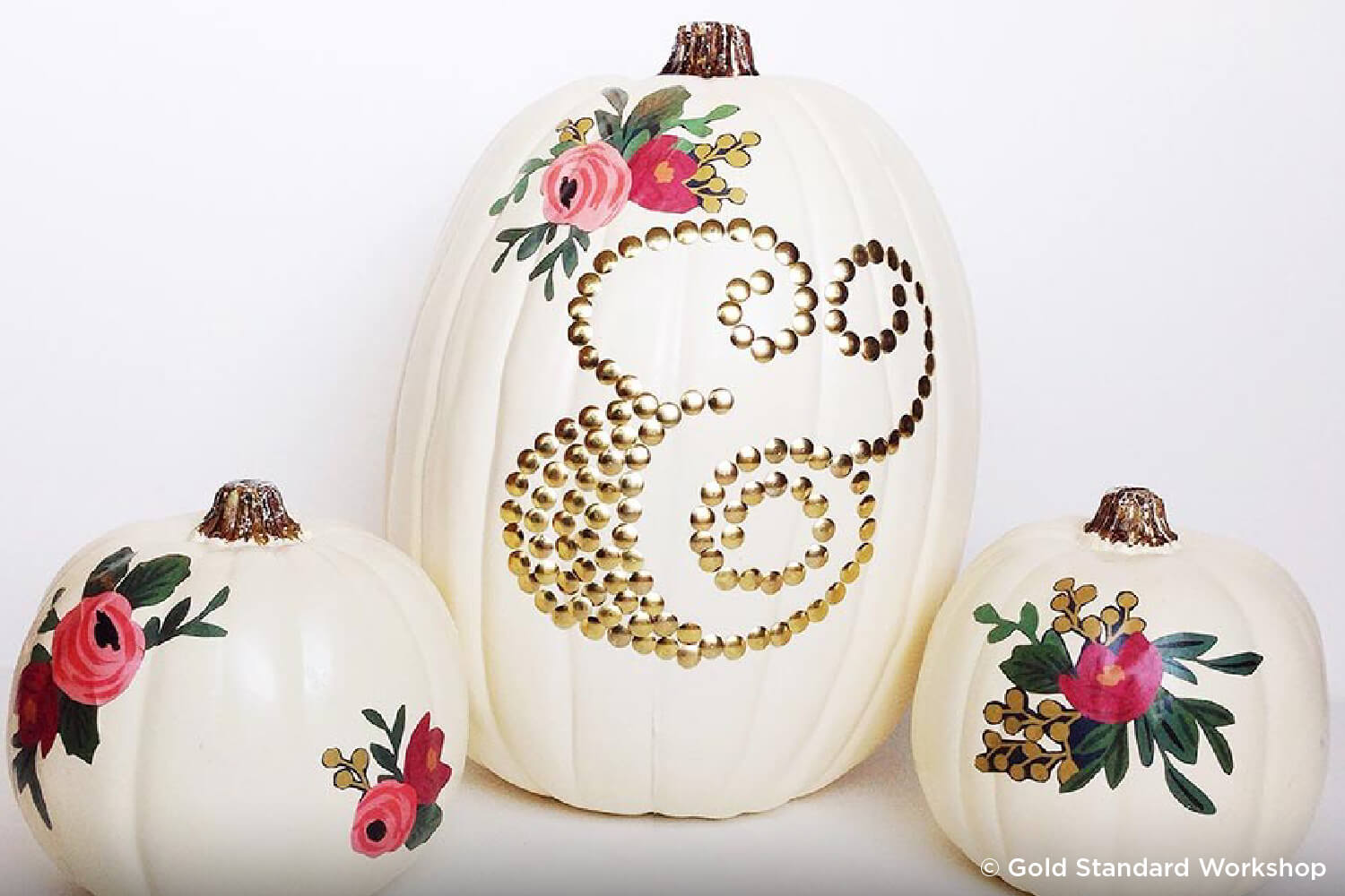 pumpkin decorated with thumb tacks