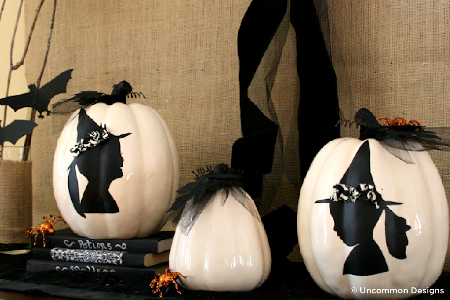 pumpkins painted with witch sillouettes