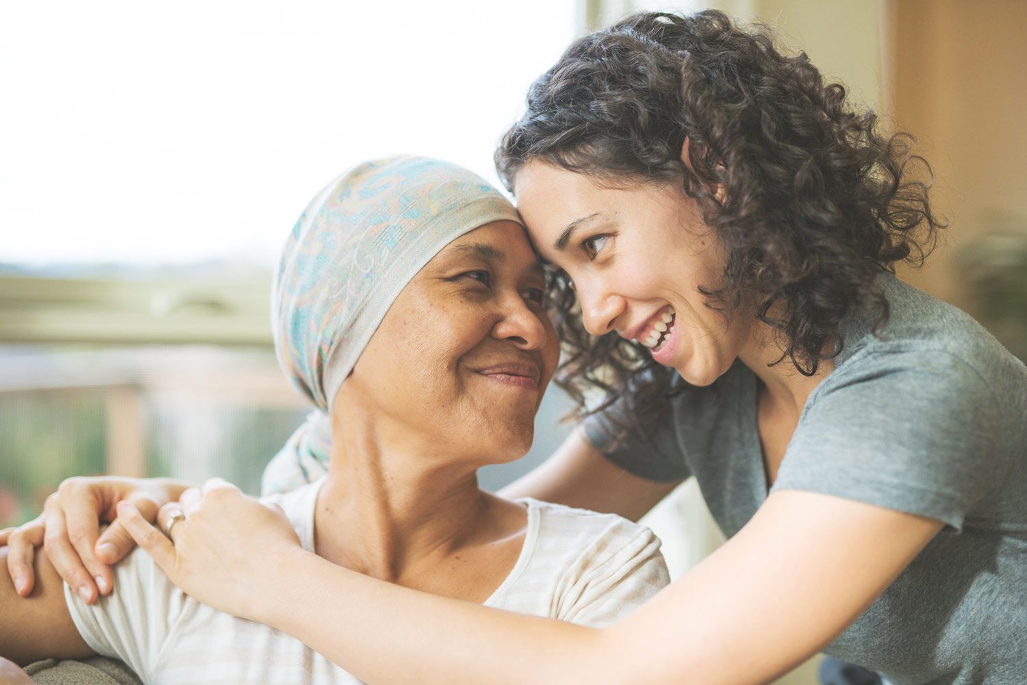 woman hugging elderly mom 